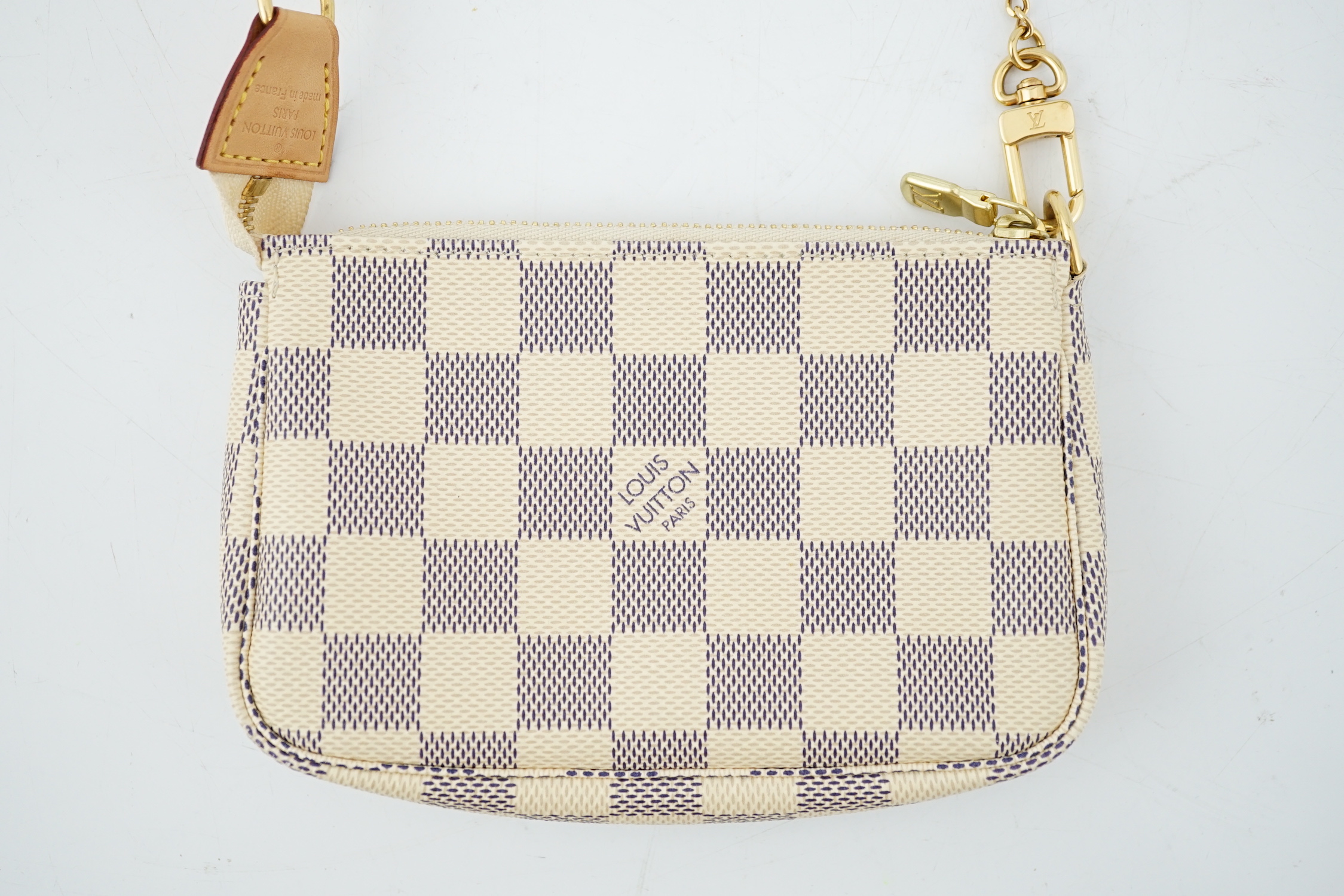 A Louis Vuitton white check mini handbag, height 10cm, width 15cm